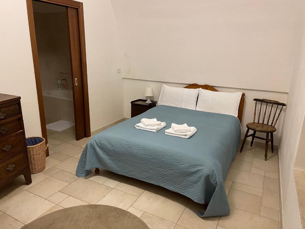 Łóżko lub łóżka w pokoju w obiekcie Casa Trieste