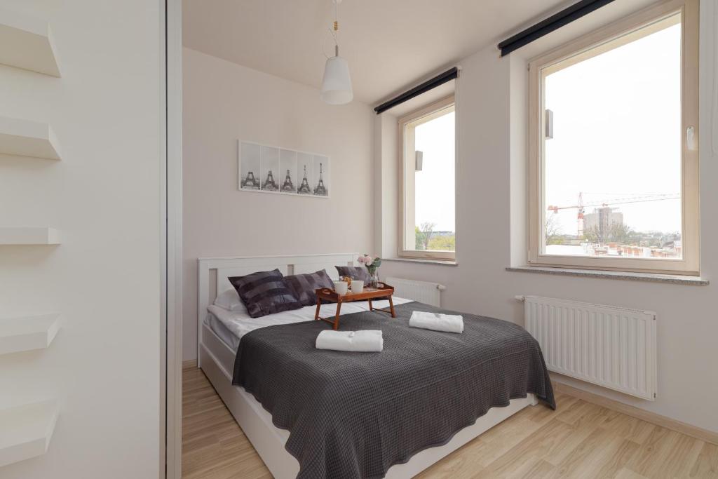Posteľ alebo postele v izbe v ubytovaní Lea Apartments Kraków Krowodrza by Noclegi Renters