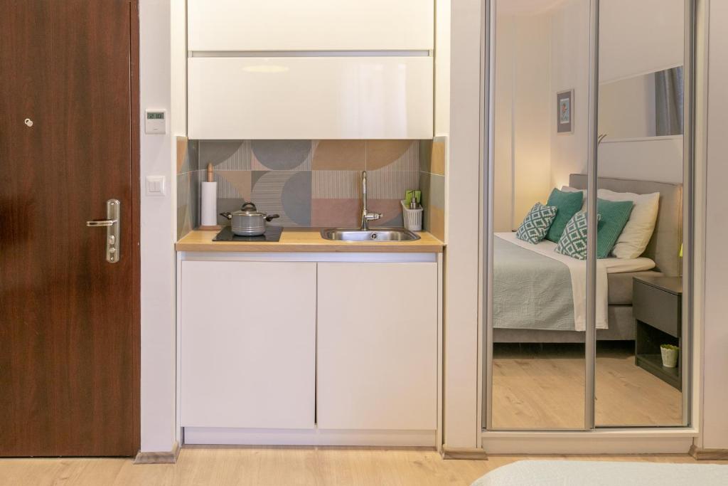 Kuchyň nebo kuchyňský kout v ubytování Polai Center Apartments