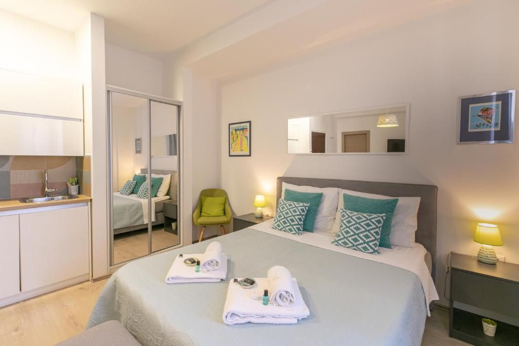 Postel nebo postele na pokoji v ubytování Polai Center Apartments