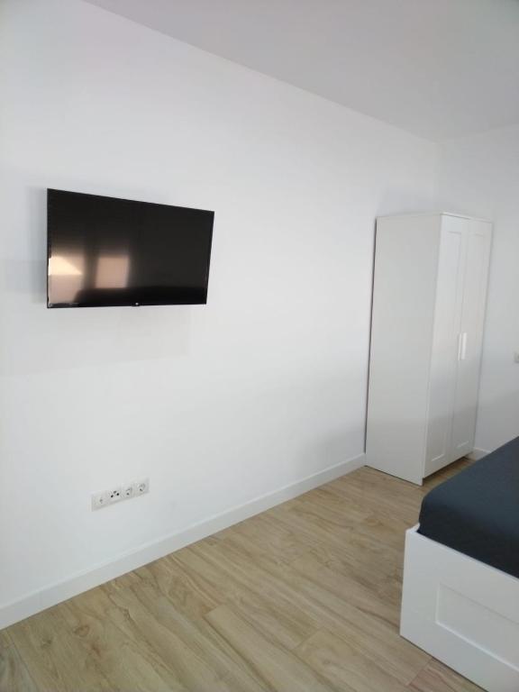 Telewizja i/lub zestaw kina domowego w obiekcie CASTRO Suites Osuna