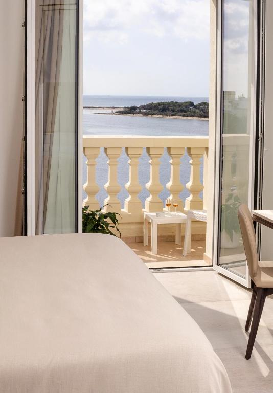 Postel nebo postele na pokoji v ubytování Hotel Falli