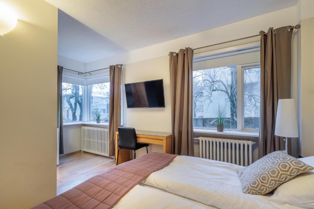 Postel nebo postele na pokoji v ubytování Snorri's Guesthouse