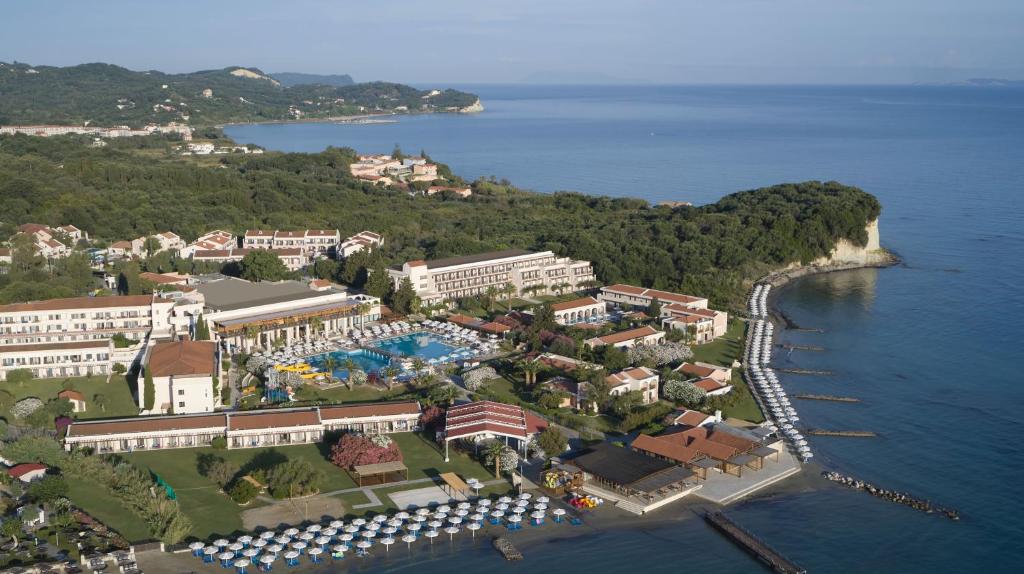 an aerial view of a resort on the water at Roda Beach Resort & Spa in Karousádes