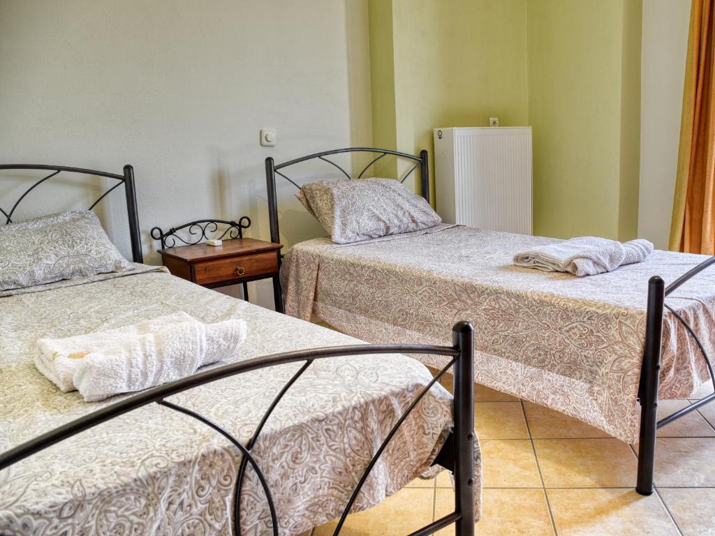 Postel nebo postele na pokoji v ubytování Tagkas Apartments