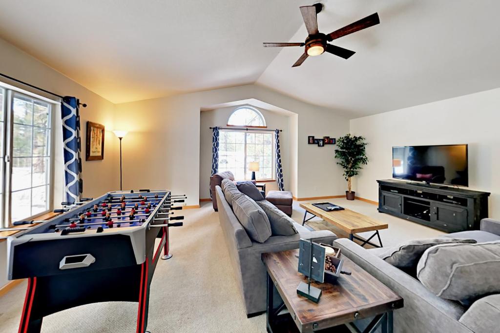 a living room with a foosball game on a table at Gold Dust Escape in South Lake Tahoe