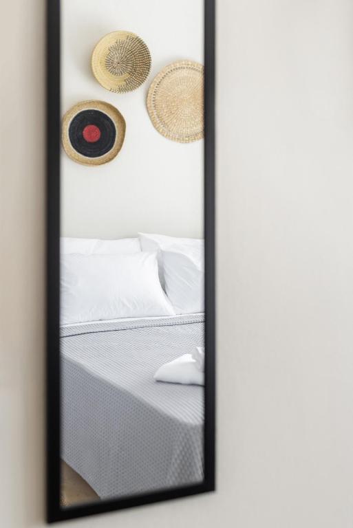 A bed or beds in a room at Boho Rooms
