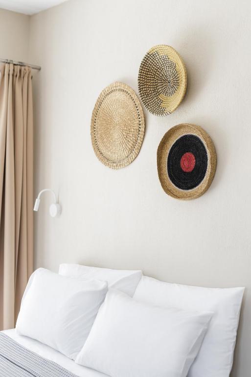 A bed or beds in a room at Boho Rooms