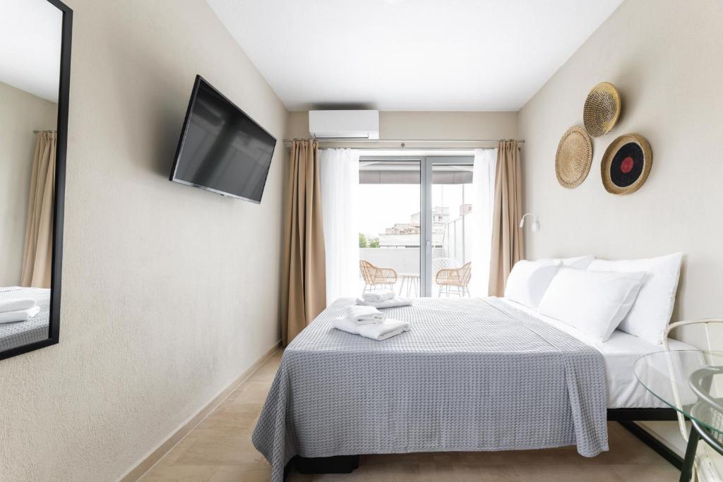 A bed or beds in a room at Boho Rooms