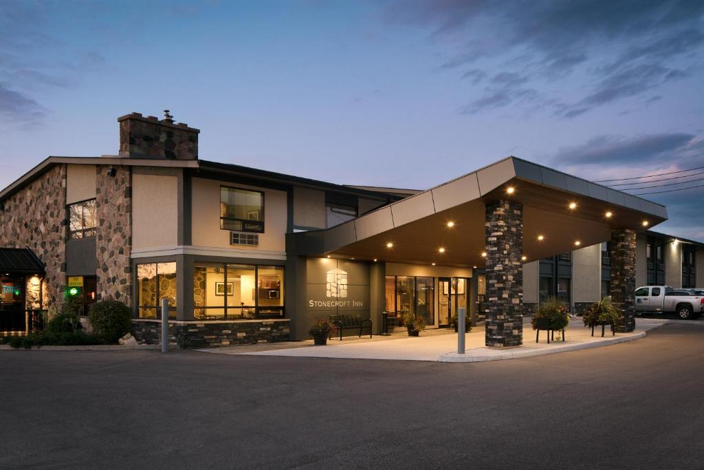 a building with a parking lot in front of it at Stonecroft Inn in Windsor