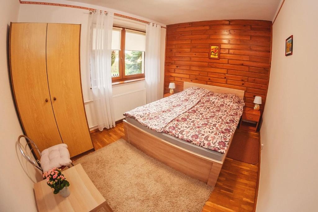 Postel nebo postele na pokoji v ubytování Za górami, za lasami