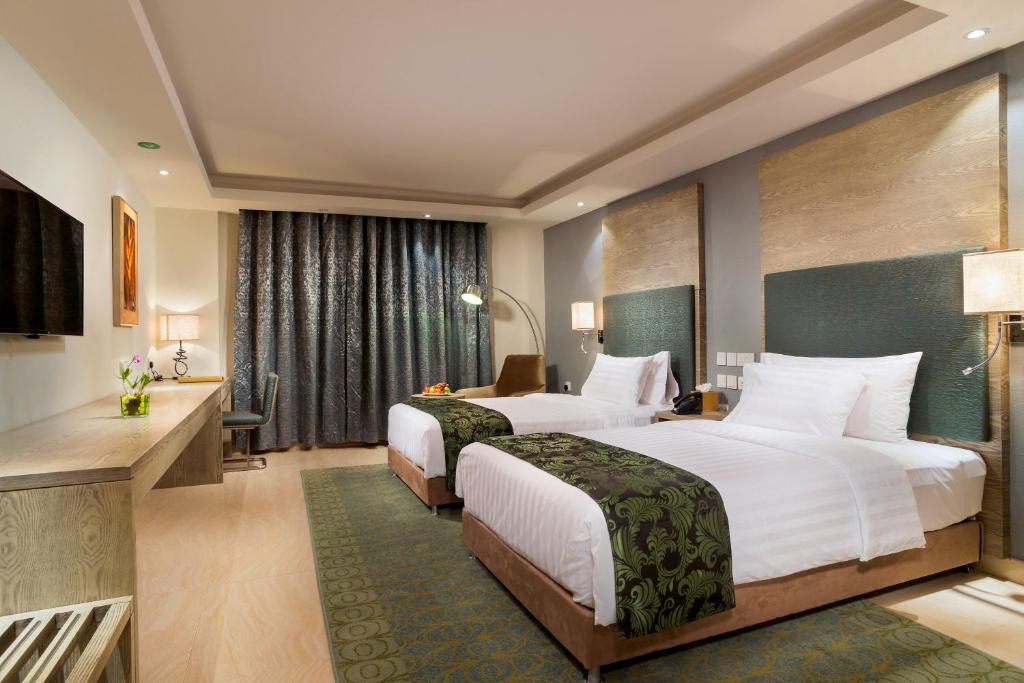 Centara Muscat Hotel Omanにあるベッド