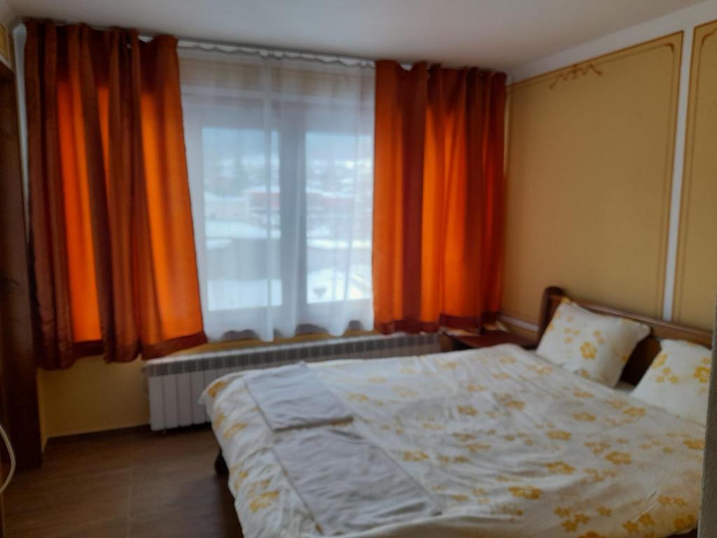 Postel nebo postele na pokoji v ubytování Къща Ради