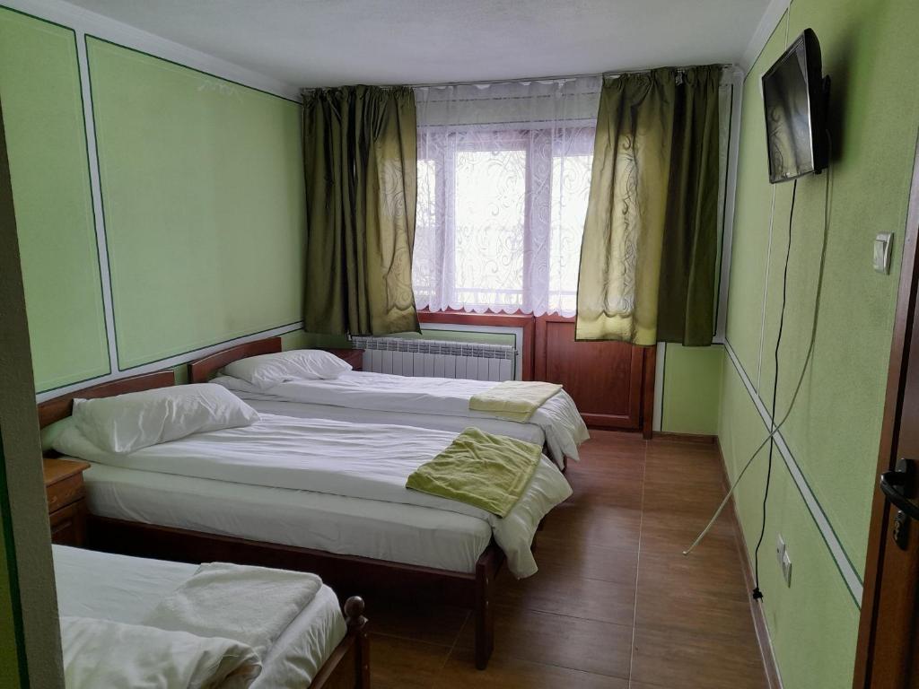Postel nebo postele na pokoji v ubytování Къща Ради