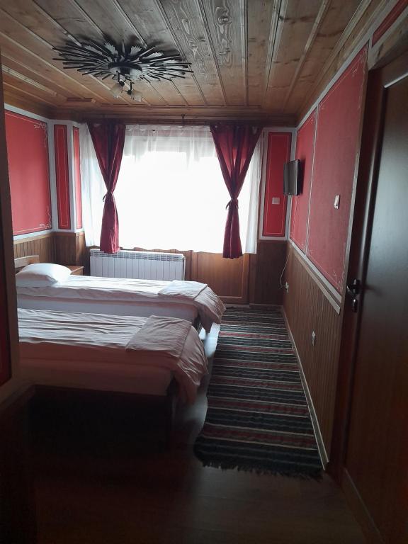 Postel nebo postele na pokoji v ubytování Къща Ради