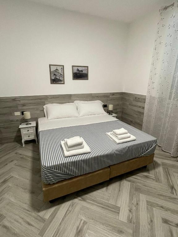 Postel nebo postele na pokoji v ubytování Holiday Rooms Rho