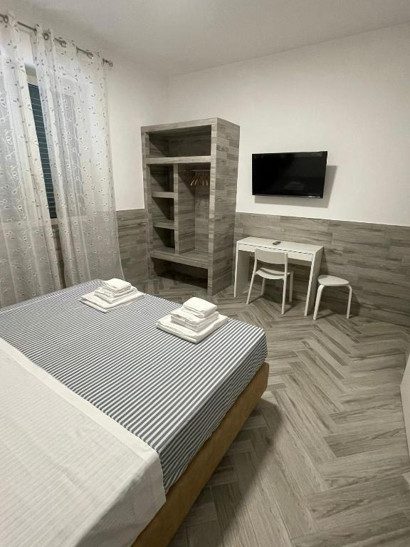 TV a/nebo společenská místnost v ubytování Holiday Rooms Rho
