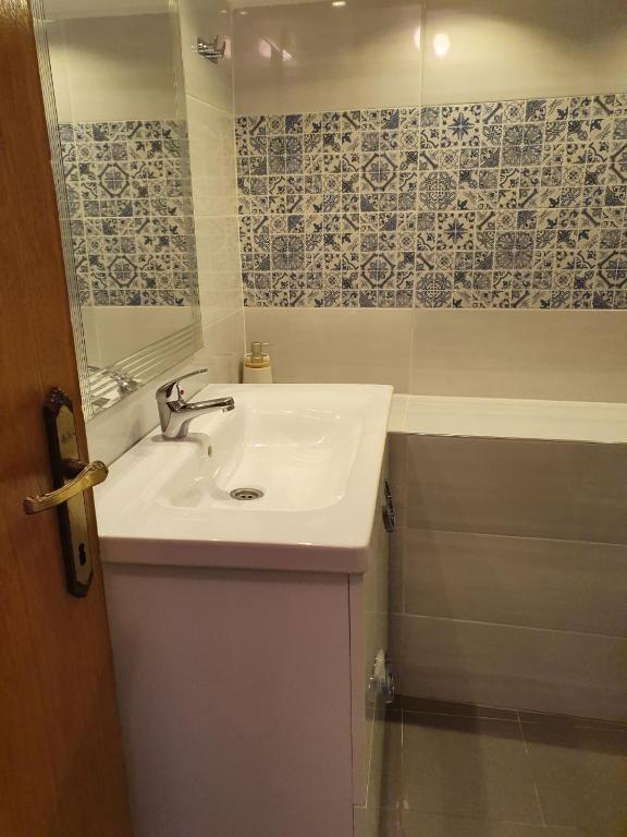 a bathroom with a sink and a mirror at Old Town Baska in Baška