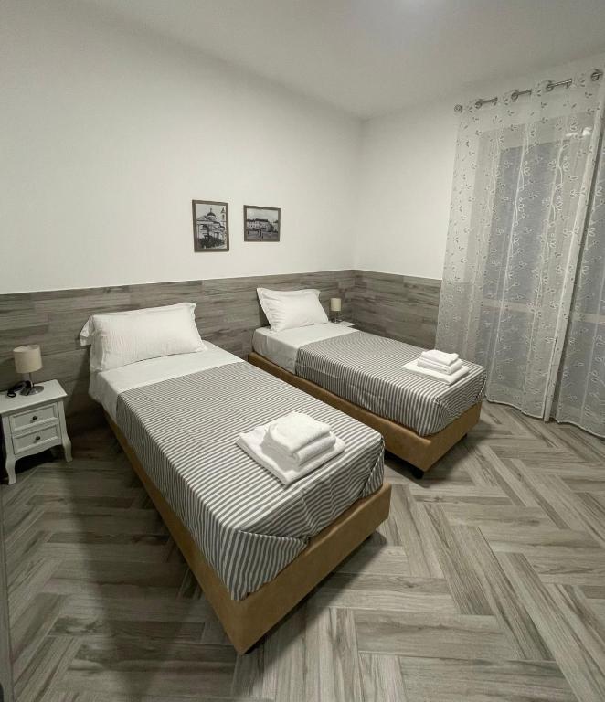 Postel nebo postele na pokoji v ubytování Holiday Rooms Rho