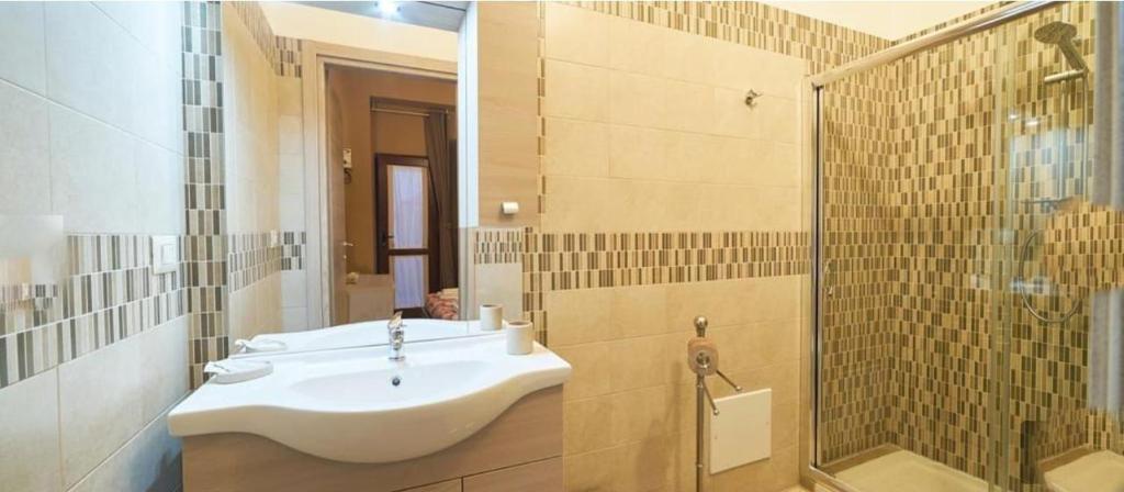 a bathroom with a sink and a shower at Villa Alfea CAMERE in Porto Cesareo