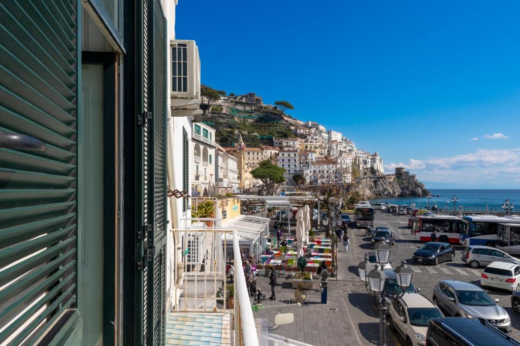 a view of positano from a balcony of a building at Lu Penniell in Amalfi