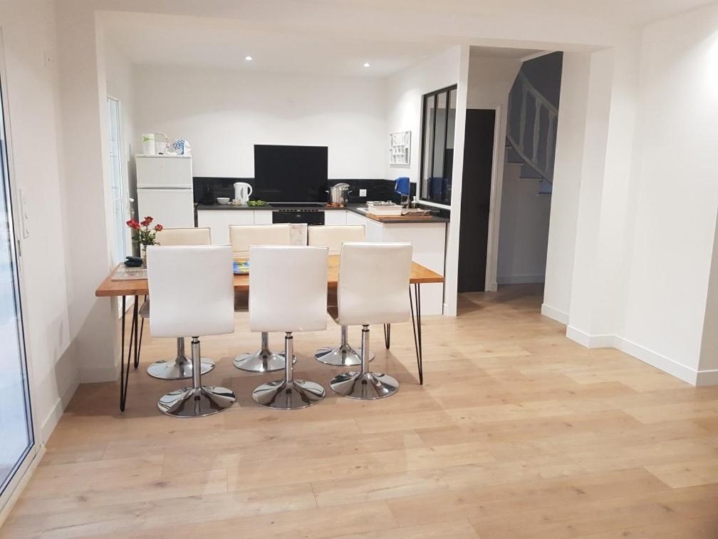 a kitchen and dining room with a table and chairs at Maison la Londe in La Londe-les-Maures