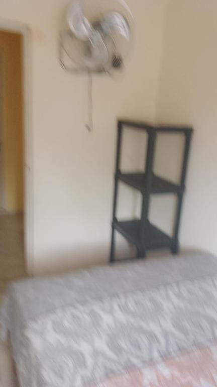 Postel nebo postele na pokoji v ubytování El Rincón del Ángel Tuxpan