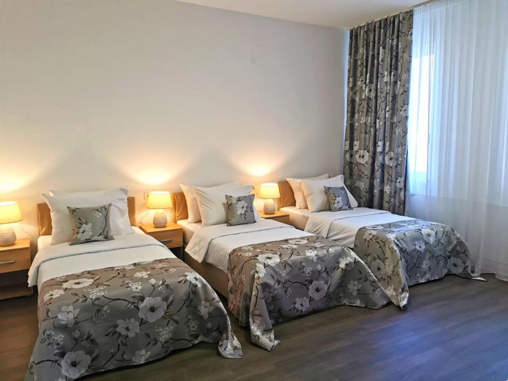 Postel nebo postele na pokoji v ubytování Hotel N