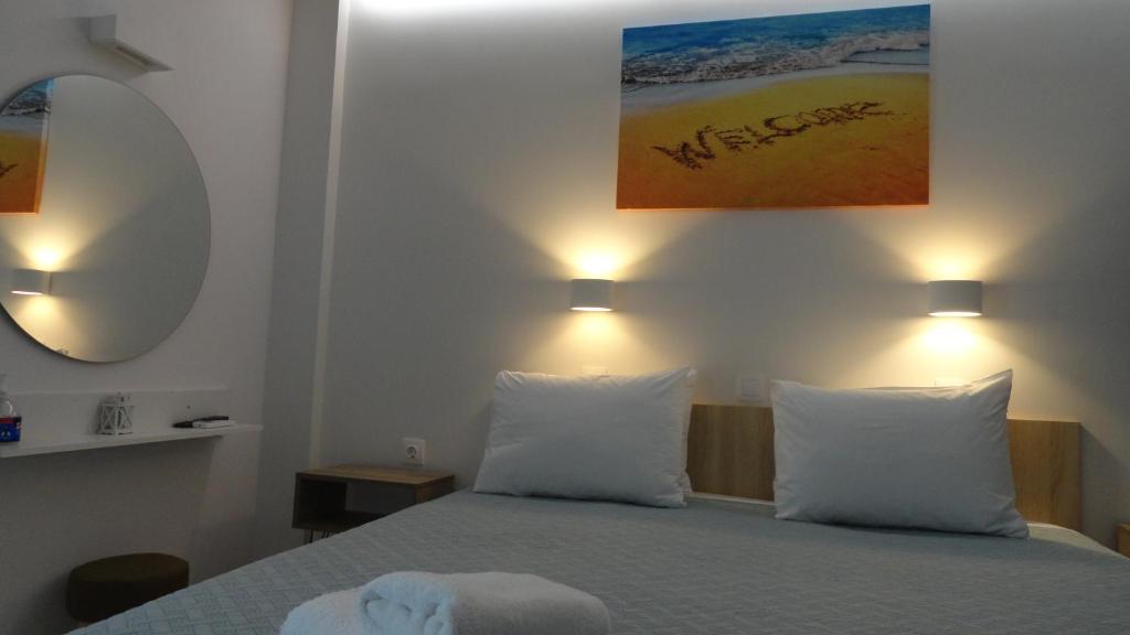 Postel nebo postele na pokoji v ubytování Afroditi Hotel