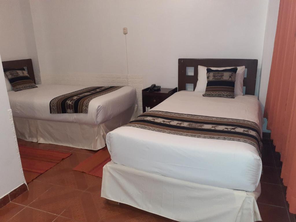 Ein Bett oder Betten in einem Zimmer der Unterkunft Inkas Land