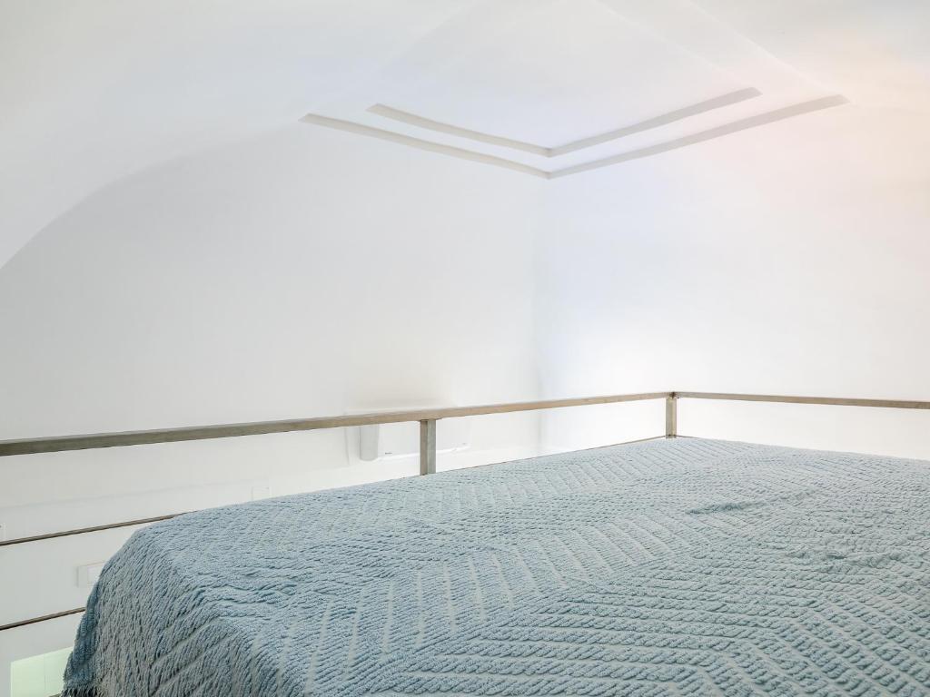 Posteľ alebo postele v izbe v ubytovaní Santoro Suite - De Vivo Realty Sorrento