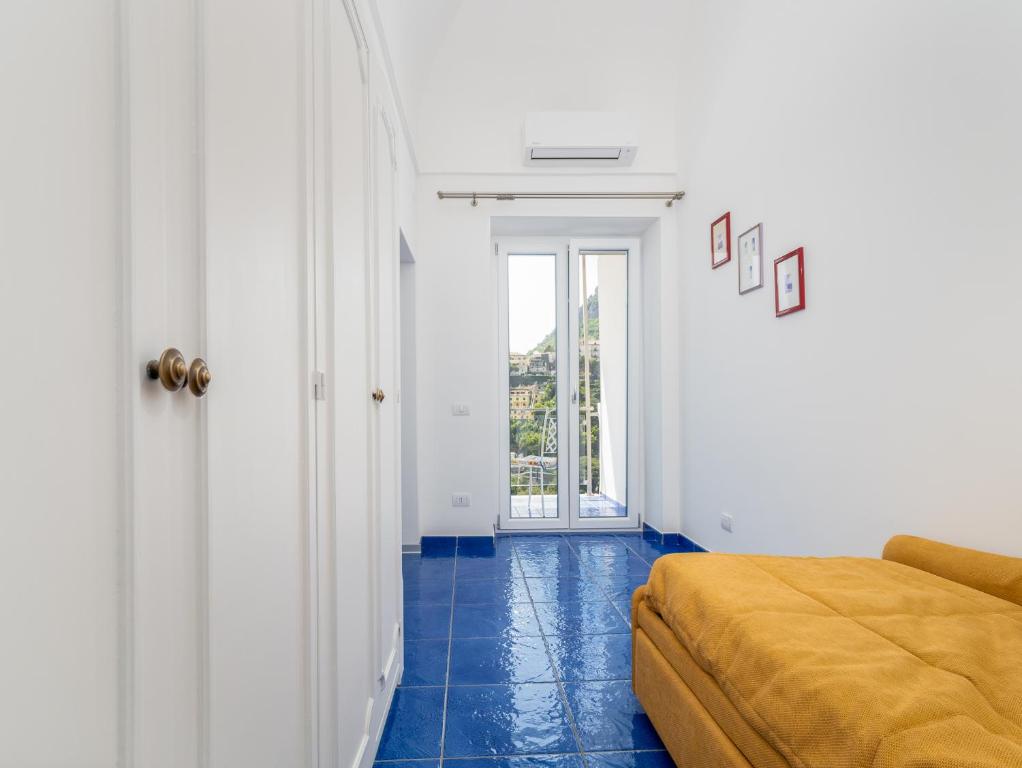 Posteľ alebo postele v izbe v ubytovaní Santoro Suite - De Vivo Realty Sorrento
