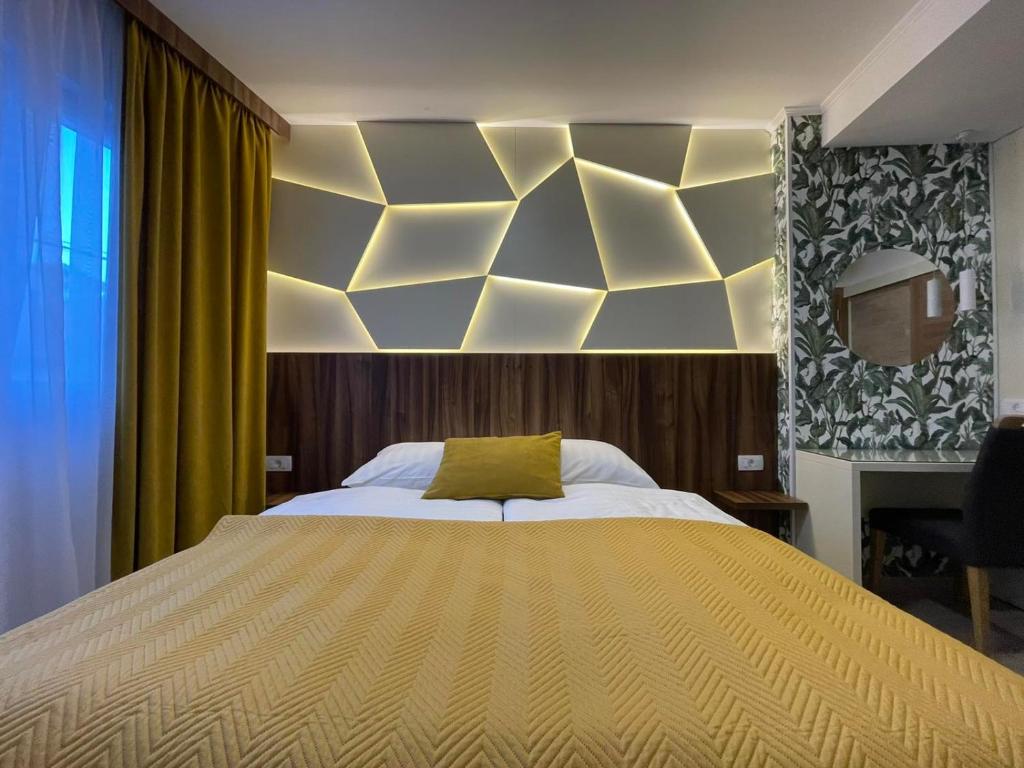 Postel nebo postele na pokoji v ubytování Hotel - Villa Lejla