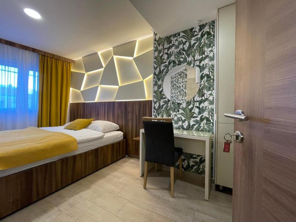 Postel nebo postele na pokoji v ubytování Hotel - Villa Lejla