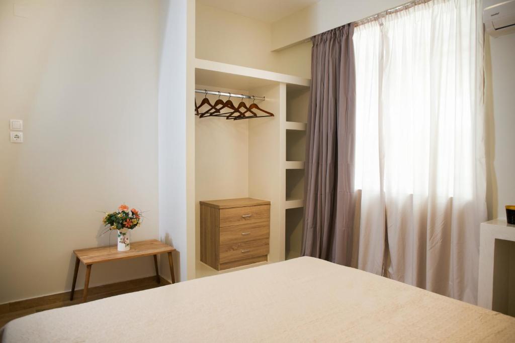 Postel nebo postele na pokoji v ubytování Praxitelis Luxury Apartments
