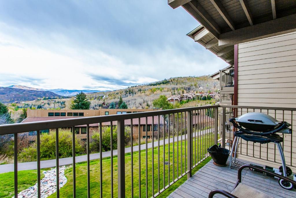 a grill on the balcony of a house at Snowmass Mountain by Snowmass Vacations in Snowmass Village