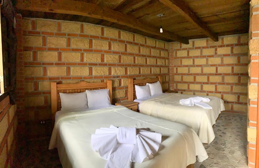 Postel nebo postele na pokoji v ubytování Hotel La Condesa