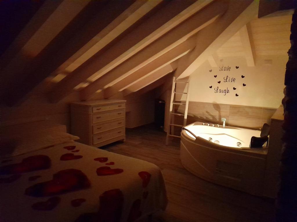 A bed or beds in a room at White suite - Jacuzzi, Swimming pool & Lake view
