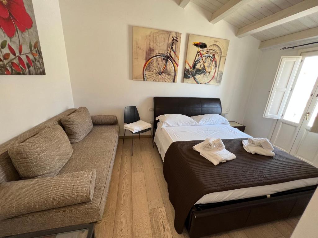 Postel nebo postele na pokoji v ubytování Plaza Rooms