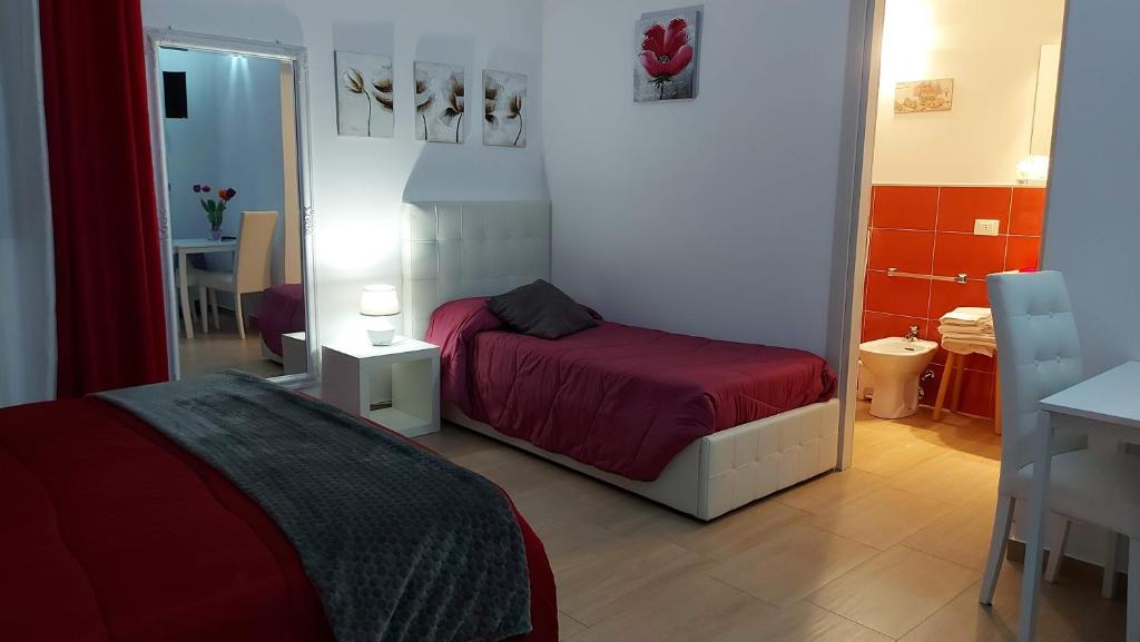 A bed or beds in a room at La Suite Di Segesta