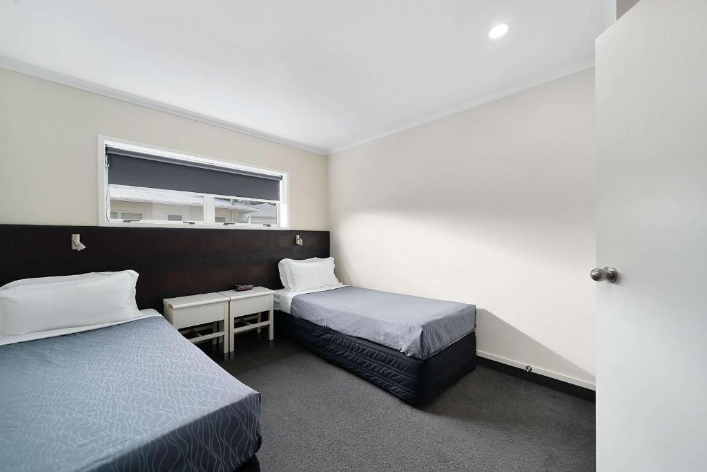 Postel nebo postele na pokoji v ubytování Quality Inn Napier