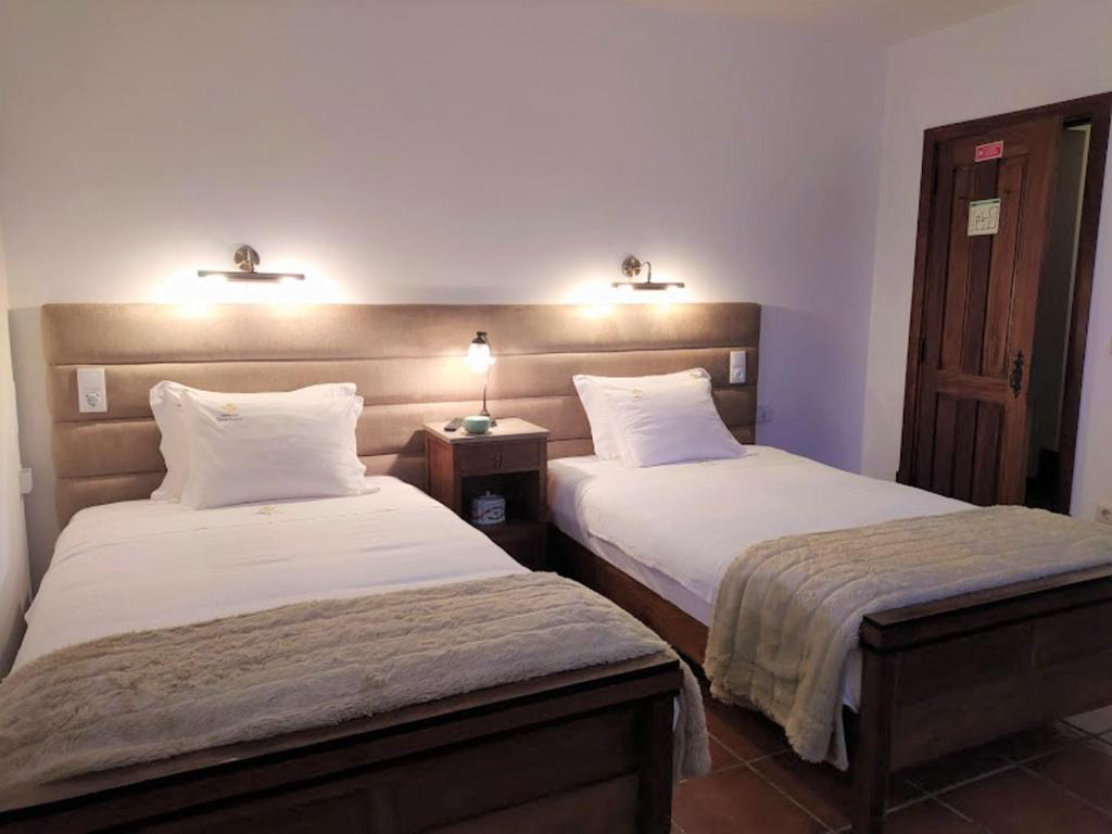 Postel nebo postele na pokoji v ubytování Casa de Sequiade