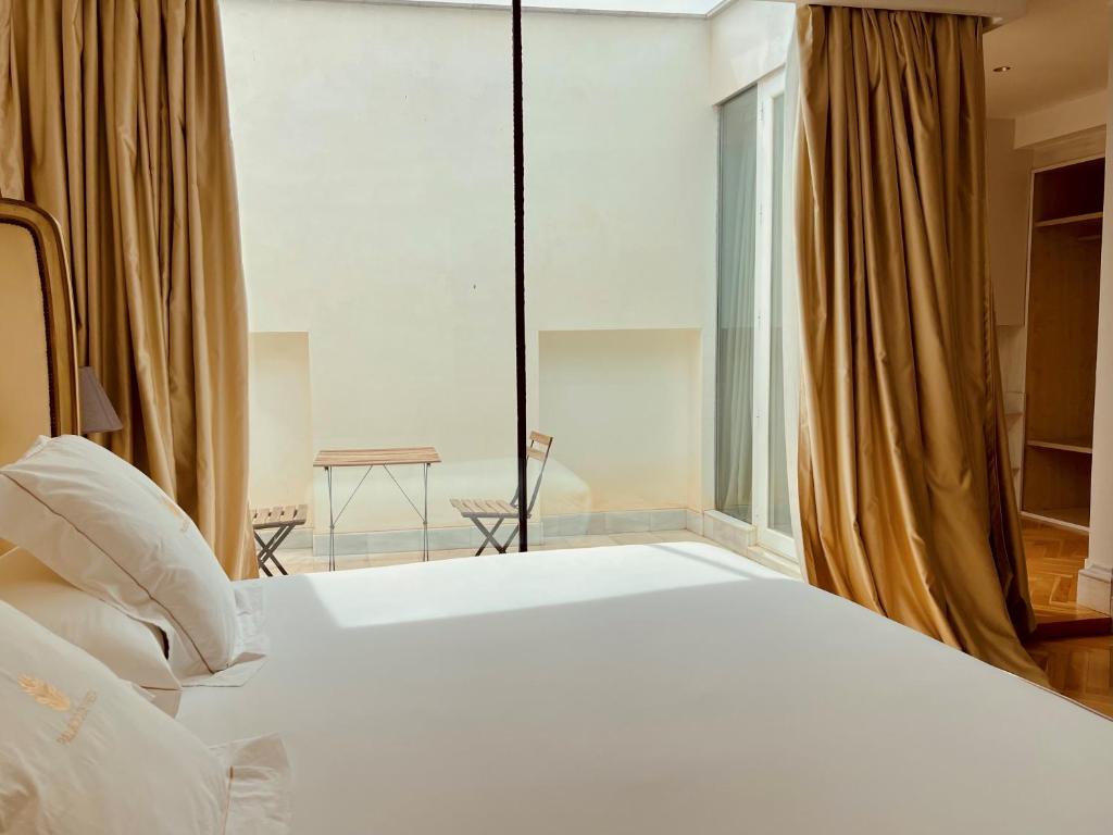 Postel nebo postele na pokoji v ubytování Hotel Palacio De Úbeda 5 G.L
