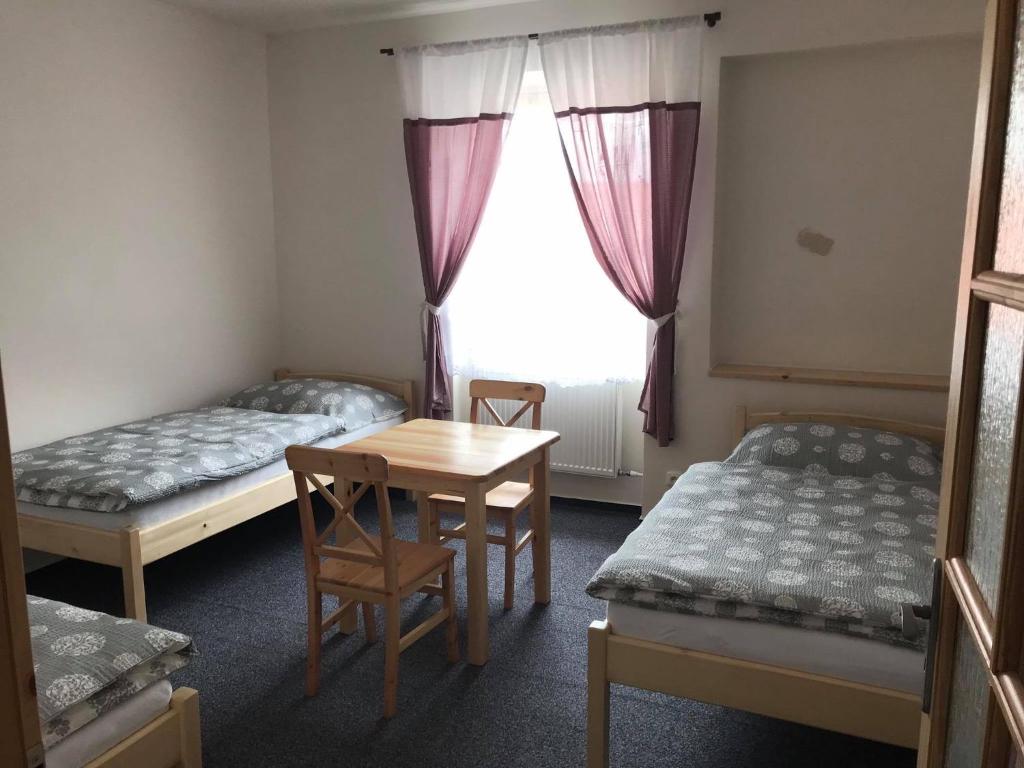 Postel nebo postele na pokoji v ubytování Hotel Pod Stráží