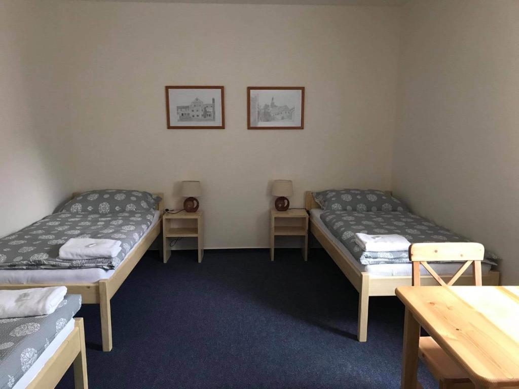 Postel nebo postele na pokoji v ubytování Hotel Pod Stráží