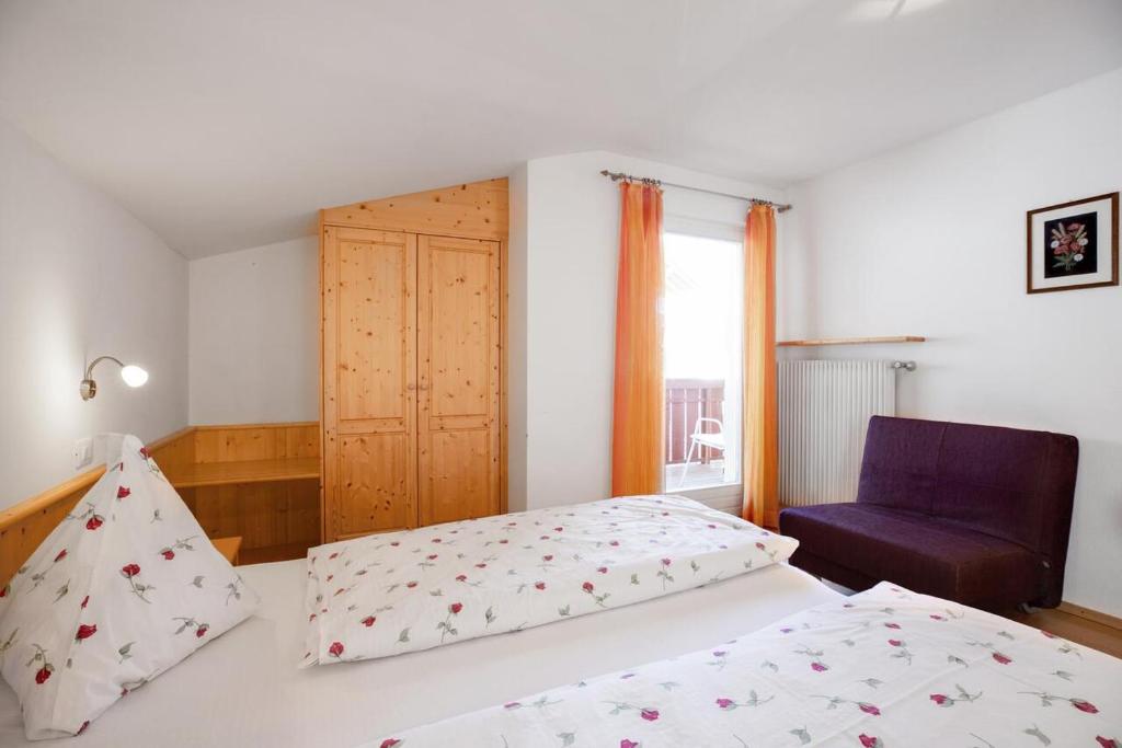 A bed or beds in a room at Appartements Beikircher