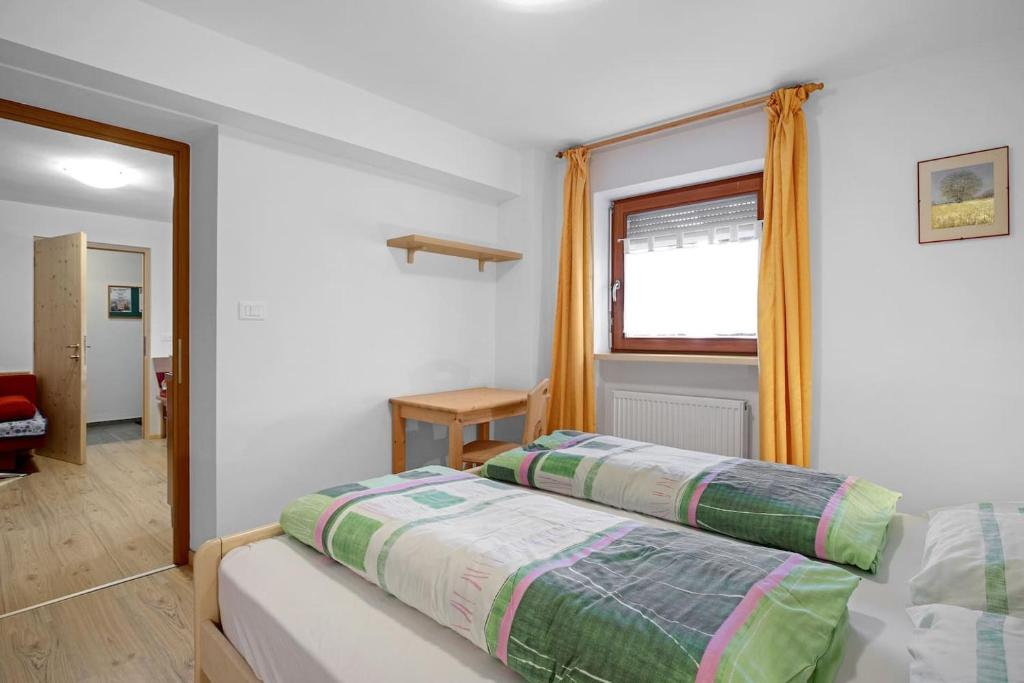 A bed or beds in a room at Appartements Beikircher