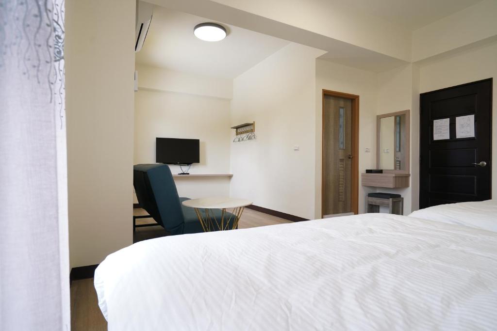 Postel nebo postele na pokoji v ubytování 享悅二館電梯民宿