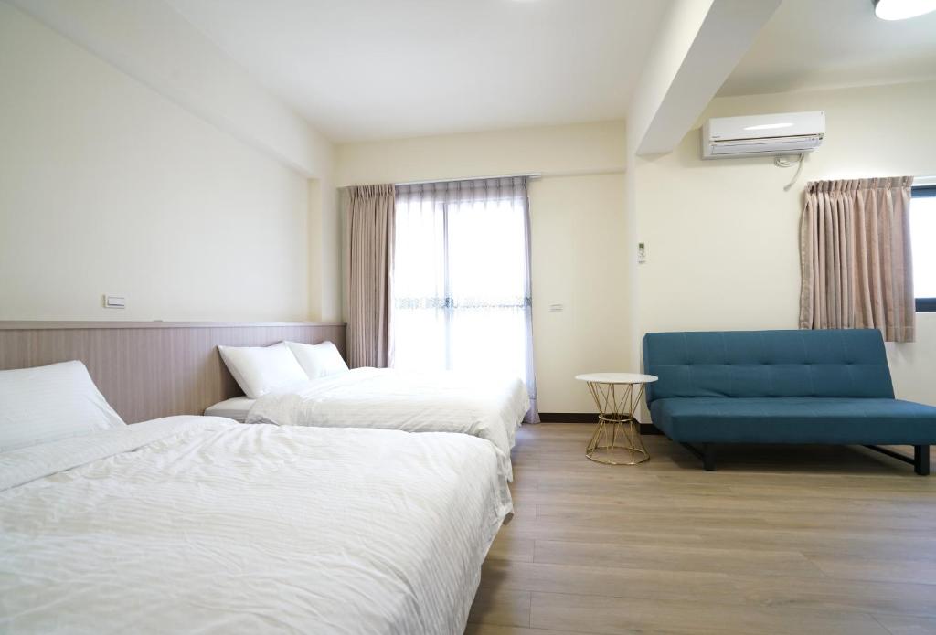 Postel nebo postele na pokoji v ubytování 享悅二館電梯民宿