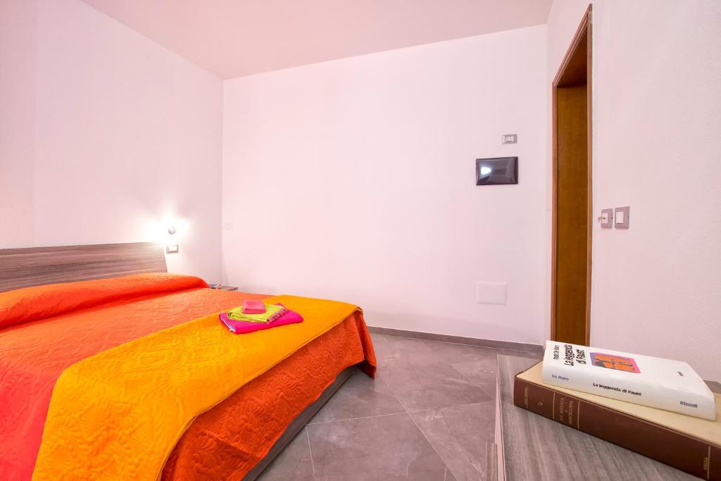 Postel nebo postele na pokoji v ubytování Nonna Adelina Apartments & rooms